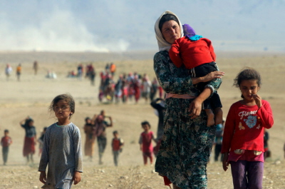 Jazydzi zmuszeni do ucieczki w sierpniu 2014 r. po zajciu ich miasta Sindar przez ISIS i dokonanej tam masakrze. (Foto: Reuters)
