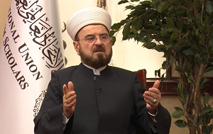<span>Powizany z Bractwem Muzumaskim Midzynarodowy Zwizek Muzumaskich Uczonych (IUMS), z siedzib w Katarze, wyda fatw (islamskie orzeczenie) wzywajc do dihadu (witej wojny) przeciwko Izraelowi. Fatwa, opublikowana przez Sekretarza Generalnego IUMS, Alego al-Karadaghiego, wzywa do „pilnych, szeroko zakrojonych dziaa krajów i narodów muzumaskich, w tym dziaa militarnych [przeciwko Izraelowi]”. Na zdjciu: Al-Karadaghi (ródo zdjcia: Wikipedia)</span>