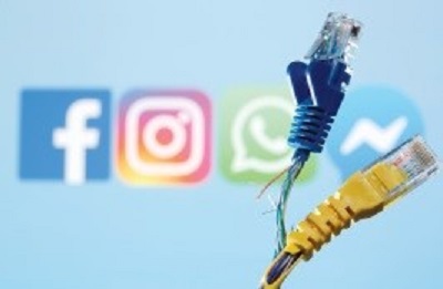 Przed logo Facebooka, WhatsApp, Instagramu i  Messengera widać przerwane kable ethernetu na ilustracyjnym zdjęciu zrobionym w tym tygodniu(photo credit: DADO RUVIC/REUTERS) 