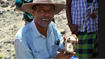 <span>Yohannes Haile-Selassie with the skull. Photograph: AFP/Getty Images</span>